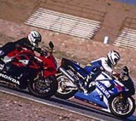 2001 open class shootout motorcycle com, Not an uncommon sight at the track The Suzuki out in front of the mellower Honda On the street however