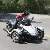 2008 can am spyder test motorcycle com, The Spyder can be thrown into corners with abandon thanks to the steadiness of three wheels and electronic stability control