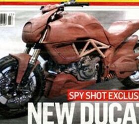 2011 ducati mega monster spy shots motorcycle com, This image scanned from England s Motor Cycle News reveals two key ingredients of the Mega Monster side mount radiators and a horizontal rear shock