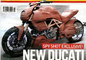 2011 ducati mega monster spy shots motorcycle com, This image scanned from England s Motor Cycle News reveals two key ingredients of the Mega Monster side mount radiators and a horizontal rear shock