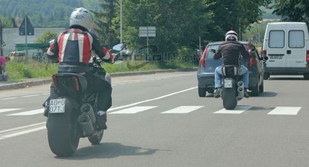 2011 ducati mega monster spy shots motorcycle com, This view reveals a low seat height and a wide 240 250mm rear meat plus shotgun style exhaust Photo courtesy MotoBlog it