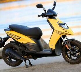2012 piaggio typhoon 125 review motorcycle com, When it comes to traveling as economically as possible on two wheels the Piaggio Typhoon 125 is hard to beat