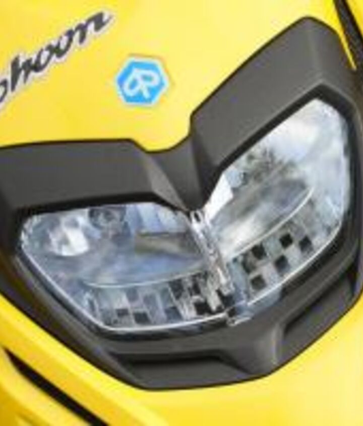 2012 piaggio typhoon 125 review motorcycle com, The standard and high beam lights shine a decent amount of light for night riding though inattentive car drivers still won t notice you