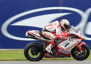 wsbk 2009 donington park results, Michel Fabrizio who has been flying in recent races appears to sprout wings as he passes a trackside logo