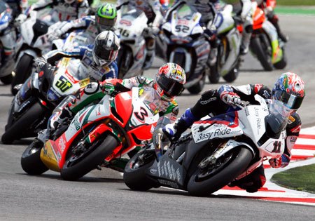 wsbk 2010 misano results, Troy Corser earned BMW its first Superpole and led for most of Race One