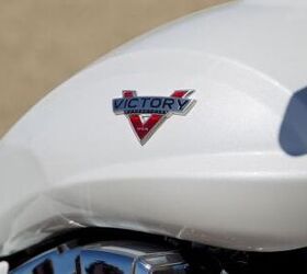 2013 victory boardwalk review motorcycle com, A close up of the Boardwalk s fuel tank better displays the simplified new logo Notice the tank s flattened area that allows for more comfortable knee placement