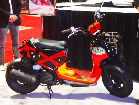 2011 progressive international motorcycle show at long beach video, Troy Lee had so much fun playing with this Honda Ruckus that he got a second one for himself