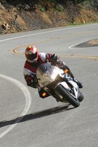 2005 cbr600rr street test motorcycle com, The CBR s ease of direction change and the excellent brakes really stand out helping you get into corners as much as the boosted midrange helps you get out of them