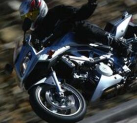 2004 honda cbr 1000 rr motorcycle com, The CBR s outstanding stability is evidenced by this one handed 90mph pass through a rough decreasing radius corner