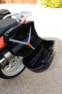 2013 bmw f800gt review motorcycle com, The panniers boast a clever shelf that discourages cargo from tumbling onto the pavement when the bags are opened