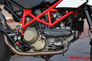 2010 ducati hypermotard 1100 evo review motorcycle com, The Evoluzione Desmodue powerplant makes its debut accompanied by a larger oil cooler
