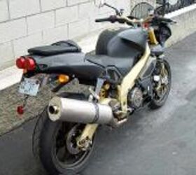 tuono means thunder motorcycle com, The Aprilia Tuono R is it worthy to be parked next to your cinderblock wall