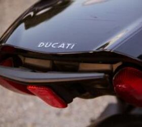 2012 ducati diavel cromo review motorcycle com, The passenger grab handle disappears beneath the passenger seat when not in use as do the passenger footpegs which discreetly fold away
