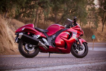 2012 kawasaki zx 14r vs 2012 suzuki hayabusa le video motorcycle com, With their large sculpted fairings both motorcycles will do a decent job of protecting riders from the wind The Suzuki offers is a convenient storage compartment underneath the rear seat hump