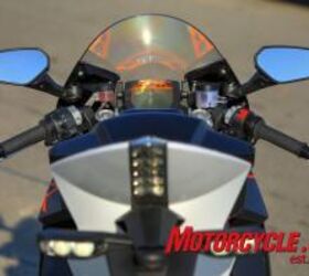 2010 ktm 1190 rc8r review motorcycle com, A compact and busy instrument cluster is sheltered by a fairly tall windscreen