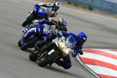 yamaha champions riding school video, Track sessions usually begin with the instructor towing students around demonstrating proper technique