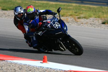 yamaha champions riding school video, Each student is encouraged to take a two up ride with one of the instructors to feel for themselves exactly what they are doing Here none other than 1993 World Superbike champion Scott Russell is taking a student around for a fast lap on one of the school s Yamaha FZ1s