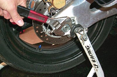 how to change your motorcycle tires motorcycle com, Though we don t condone using crescent wrenches on your bike they will work in a pinch