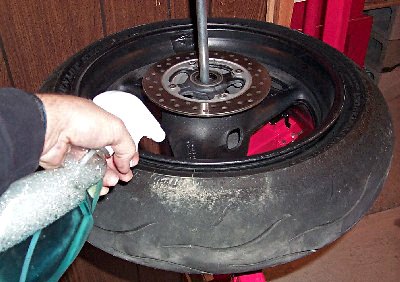 how to change your motorcycle tires motorcycle com, There are two tricks to getting a tire off its rim without a lot of muscle The first is to use plenty of soapy water