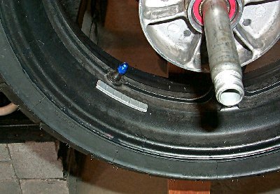 how to change your motorcycle tires motorcycle com, When balancing the basic idea is to determine where the wheel is heaviest and counter it using wheel weights