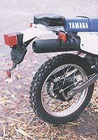 first impression 1998 yamaha xt350 motorcycle com, Gracing the rear fender is a little pouch containing the Yamaha tool kit You could fit a kit of your own inside as long as it was the size of a Kit Kat Anything else would probably be too big to fit