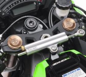 2011 kawasaki zx 10r unveiled motorcycle com, An Ohlins steering damper thwarts any instability caused by the Ninja s sharper steering geometry Note the pair of damping adjusters atop the Showa BPF fork tubes