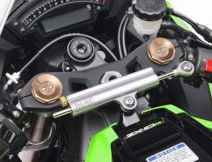 2011 kawasaki zx 10r unveiled motorcycle com, An Ohlins steering damper thwarts any instability caused by the Ninja s sharper steering geometry Note the pair of damping adjusters atop the Showa BPF fork tubes