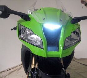 2011 kawasaki zx 10r unveiled motorcycle com, Twin line beam headlights bookend a voracious ram air duct capped off by a slick LED positioning lamp