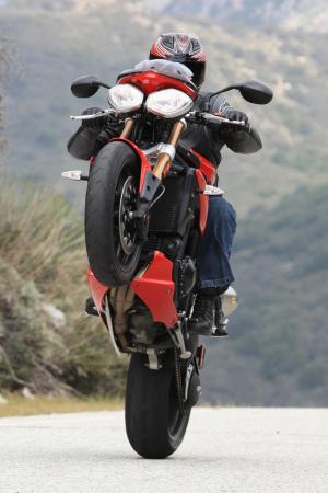 motorcycle com best of 2011 awards motorcycle com, When riding the new Triumph Speed Triple this will inevitably be what you end up doing with it It s hard not to