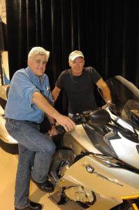 2012 bmw k1600gt and gtl six cylinder unveiled motorcycle com, Gearhead extraordinaire Jay Leno hosted the American unveiling of BMW s K1600GTL at his splendid facility Legendary actor Harrison Ford rode his BMW F800GS in the rain to check it out