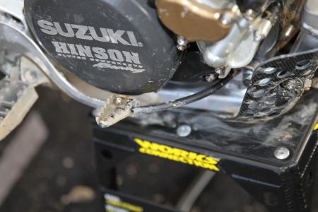 inside the 2013 supercross works bikes, Stewart runs a brake snake to prevent his brake lever from being bent back