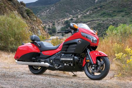 six new 2013 honda models announced for us motorcycle com, The Deluxe comes equipped with an assortment of Honda accessories Both models are available in the two color options Black or Red and will be available in February