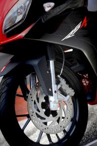 2011 aprilia rs4 125 review motorcycle com, The 300mm disc up front offers sharp response