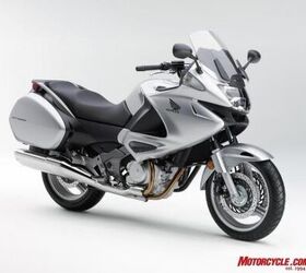 2010 honda nt700v review motorcycle com, Honda Genuine Accessories include Top Box 45 liter Red and Silver 392 95 Inner Bag Trunk Lower Top Box Pad Fairing Wind Deflector Set Knee Pad Set 99 95 Heated Grips DC Socket Tank Pad 64 95 and Outdoor Cycle Cover