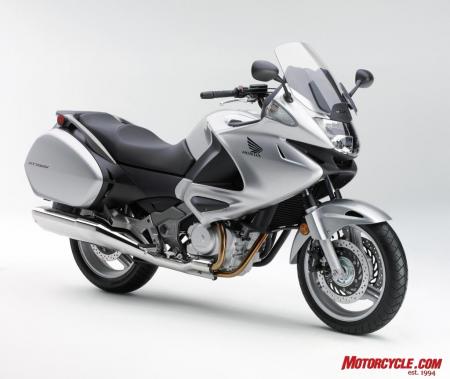 2010 honda nt700v review motorcycle com, Honda Genuine Accessories include Top Box 45 liter Red and Silver 392 95 Inner Bag Trunk Lower Top Box Pad Fairing Wind Deflector Set Knee Pad Set 99 95 Heated Grips DC Socket Tank Pad 64 95 and Outdoor Cycle Cover