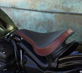 2014 star motorcycles bolt preview motorcycle com, The accessory springer seat is attractive and comfortable although the plastic cover beneath it is an eyesore Other accessories include a mini fairing brass speedo visor passenger seat and backrest tall bars and leather saddlebags