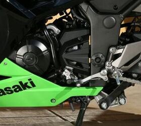 2013 kawasaki ninja 300 review motorcycle com, Because the engine is now rubber mounted and thus transmits less vibes solid foot pegs are now used without the rubber insert seen on the 250