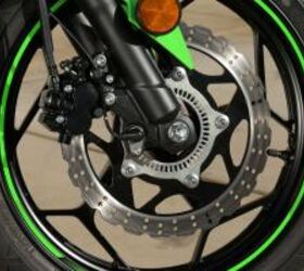 2013 kawasaki ninja 300 review motorcycle com, By now you should be used to Kawasaki s signature wavy brake discs the 300 uses only one in front measuring 290mm It can be equipped with an optional new ABS system from Nissin claimed to be the smallest and lightest unit currently in production
