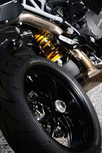 2010 ducati hypermotard 796 review motorcycle com, One more item straight from the Hypermotard 1100 is the single sided swingarm The Hypermotard 796 spins Bridgestone BT016 tires a good choice for the littlest Hyper