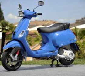2013 vespa lx and s 125 150 3v review motorcycle com, The Vespa S 150 features more angular look with a square headlight and mirrors and lacks the roomy glovebox found on the LX