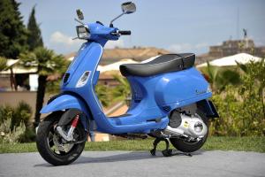 2013 vespa lx and s 125 150 3v review motorcycle com, The Vespa S 150 features more angular look with a square headlight and mirrors and lacks the roomy glovebox found on the LX
