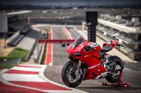 2013 ducati 1199 panigale r review video motorcycle com, The sexy beast Panigale R sits at the top of Turn 1 at Austin s Circuit of the Americas