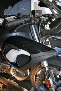 buell 1125r first look motorcycle com, This cutaway reveals one half of the pair of side mounted radiators used on the 1125R instead of the traditional single radiator placed in front of the engine Company founder Erik Buell says this method is much more efficient