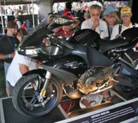 buell 1125r first look motorcycle com, This 1125R was on display at the Laguna Seca MotoGP race The clear shot of the left side of the bike is possible because the right side reveals dozens of cutaway sections that drew big crowds