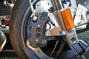 buell 1125r first look motorcycle com, Buell is the only major manufacturer to use a rim mount perimeter brake rotor The 1125R uses a single 8 piston brake caliper the first in production streetbike history on the 375mm disc Buell says it s 6 pounds lighter than a twin disc setup