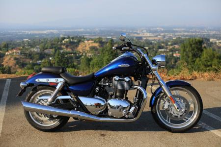 2011 world cruiser shootout video motorcycle com, American designer Tim Prentice penned the English made Triumph Thunderbird With the exception of its parallel Twin engine the T Bird looks like it was born in the U S A