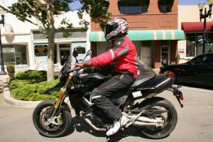2011 aprilia dorsoduro 1200 review video motorcycle com, The Aprilia s rider triangle is rather relaxed and despite the relative lack of wind protection the rider doesn t become a sail at freeway speeds