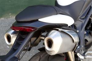 2011 triumph speed triple 1050 review motorcycle com, Among the many methods to help squeeze more power out of the 1050cc triple header pipes and secondary exhaust diameters have been revised