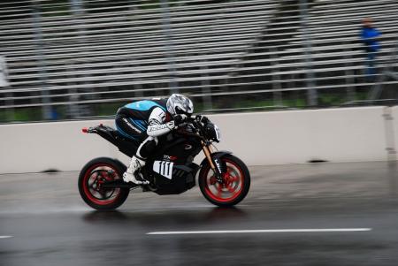racing electric motorcycles video, I decided to make the most of a wet track and D O T tires and practice my tuck along the front straight With no fairings and modest power maintaining an aerodynamic profile would be crucial Photo by Bob Edwards