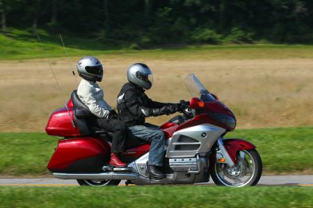 2012 honda gold wing review video motorcycle com, The back half of the Wing is a splendid place to pass the miles Carolyn was so comfortable and secure she actually got in a few naps during the trip